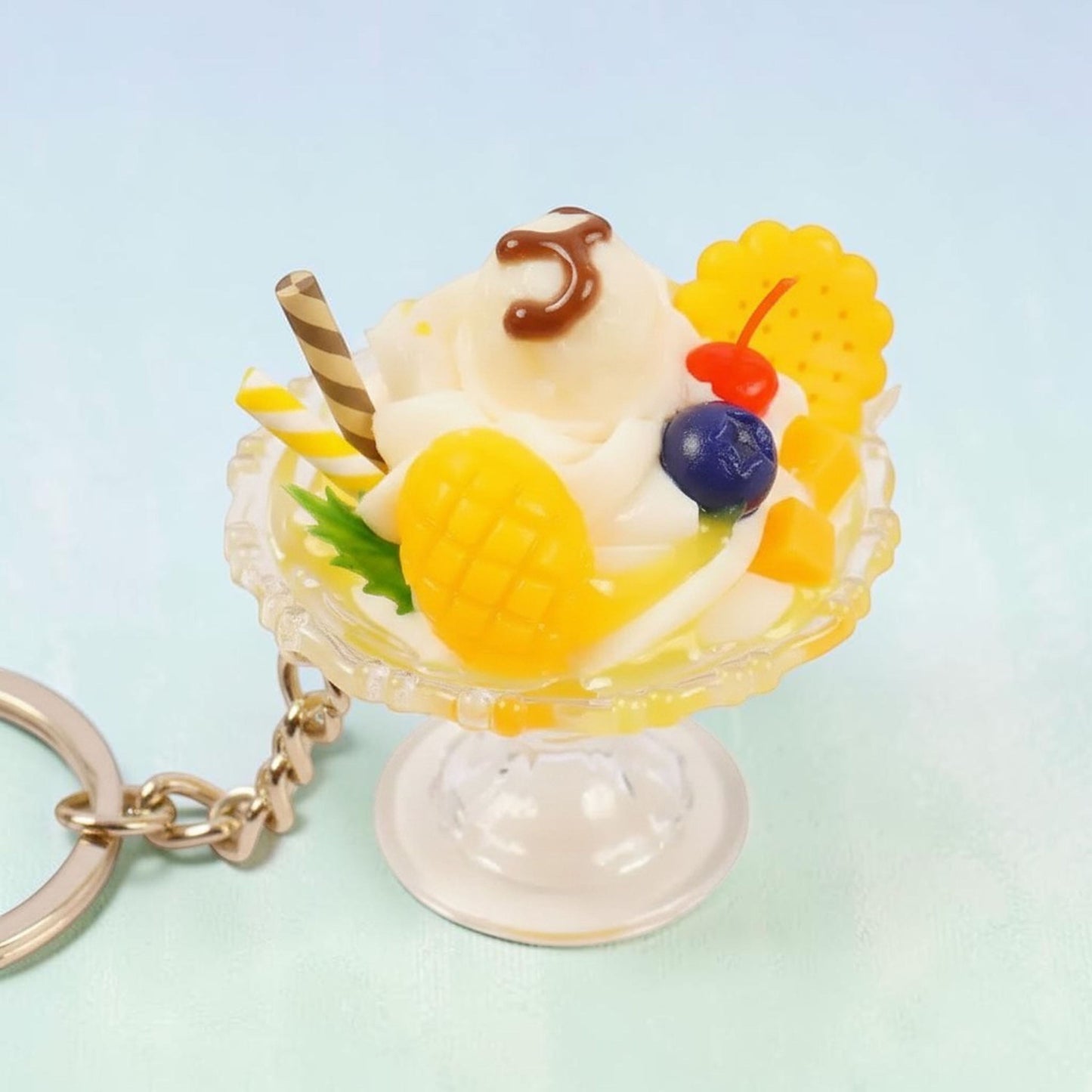 Kawaii strawberry bunny ice cream sundae keychain in pink with red bunny charm