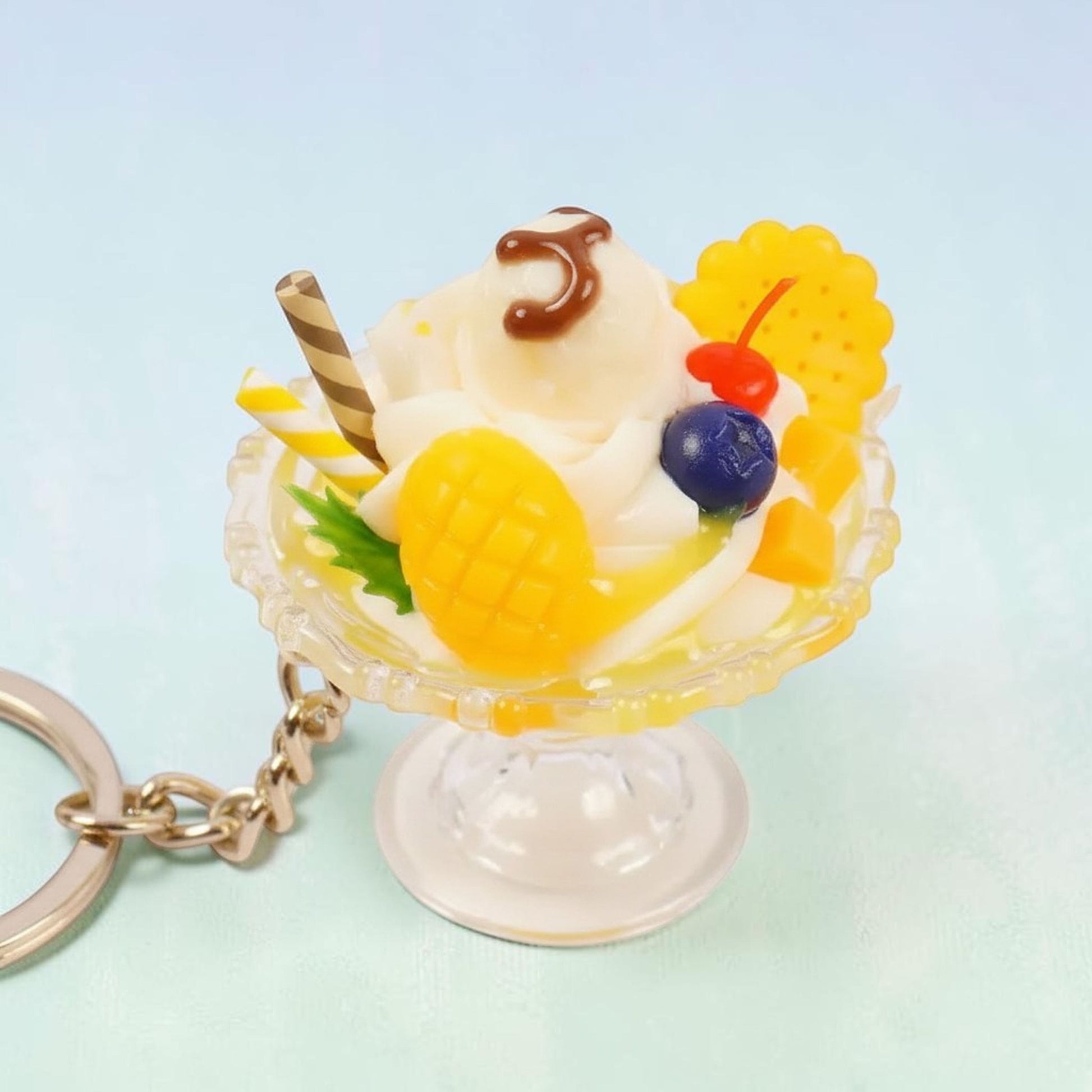Kawaii strawberry bunny ice cream sundae keychain in pink with red bunny charm