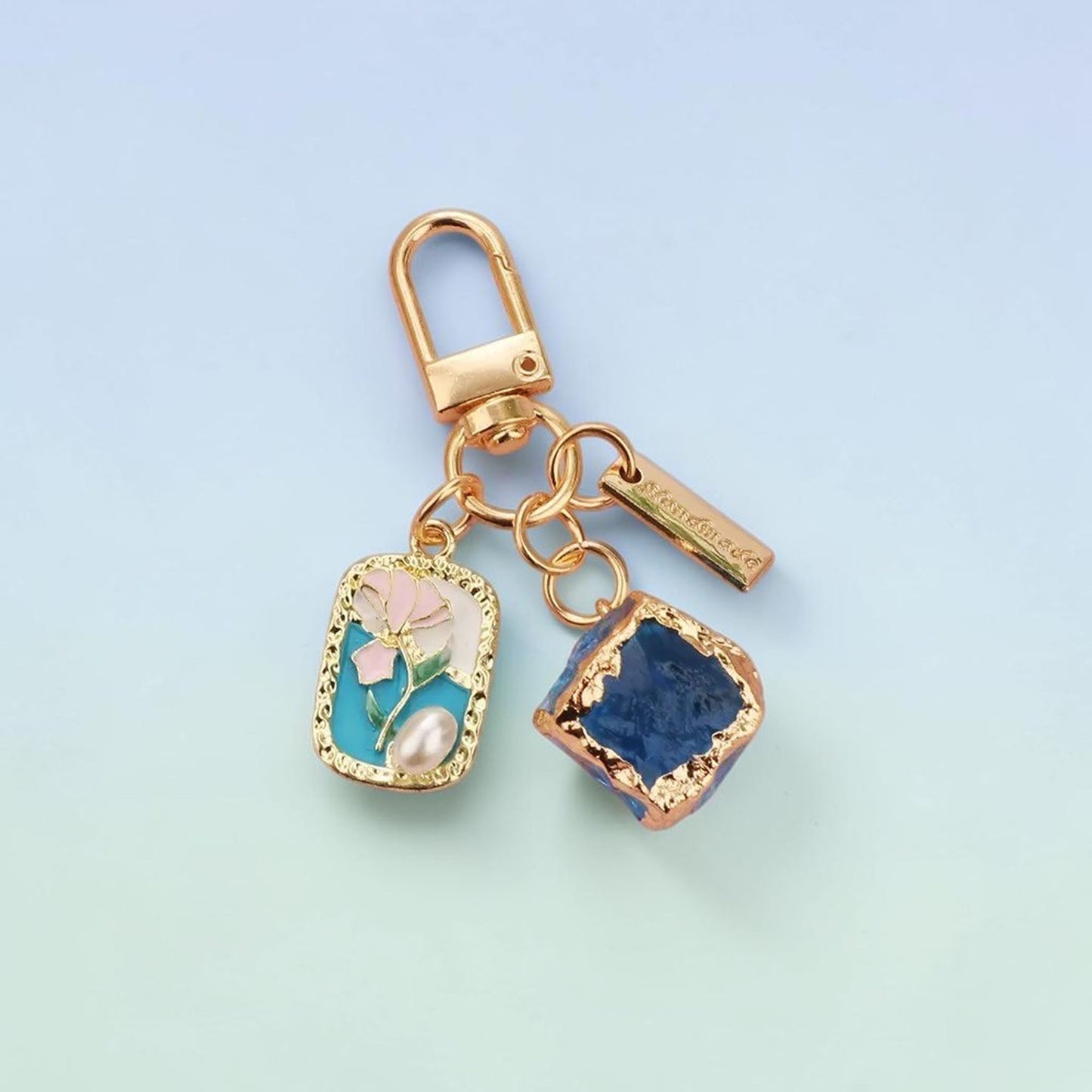 Pink tulip enamel charm keychain with rose-gold hardware