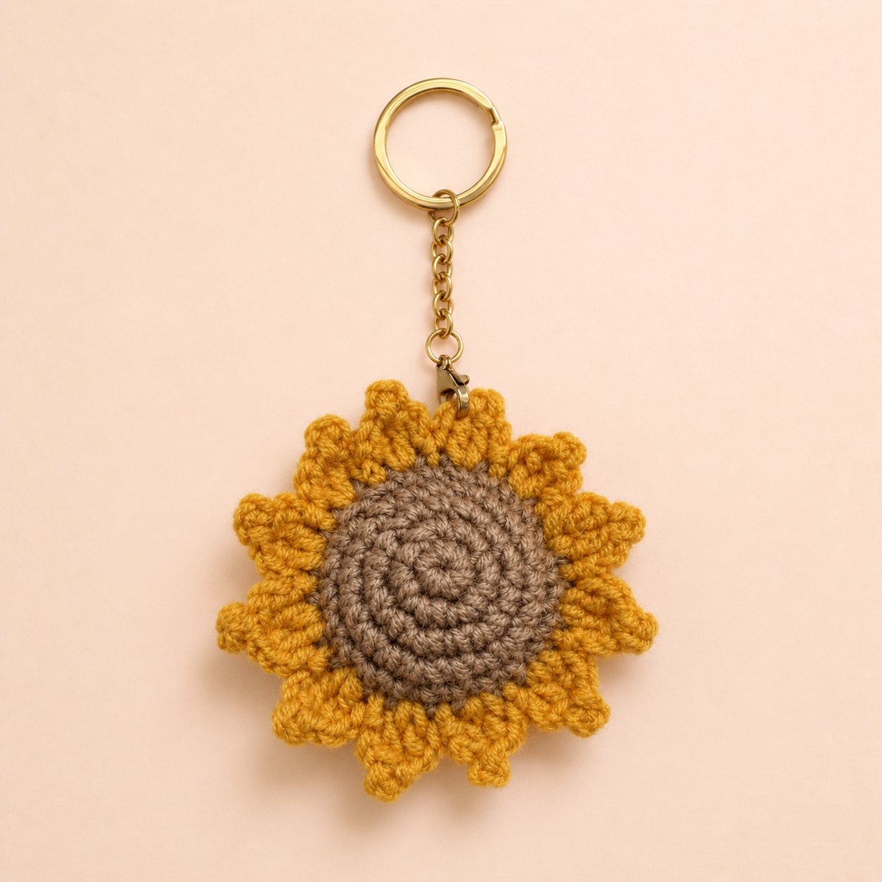 Crochet sunflower keychain with gold-tone ring